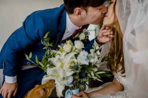 Bride and Groom first kiss with dog in sight. Tung lok Singapore Wedding Photography Shawn and Constance