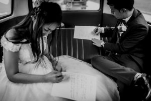 Bride and Groom writing their personal marriage vows. Actual Wedding Day AD with Volkswagen Kombi Van Classic Singapore Wedding Photographer